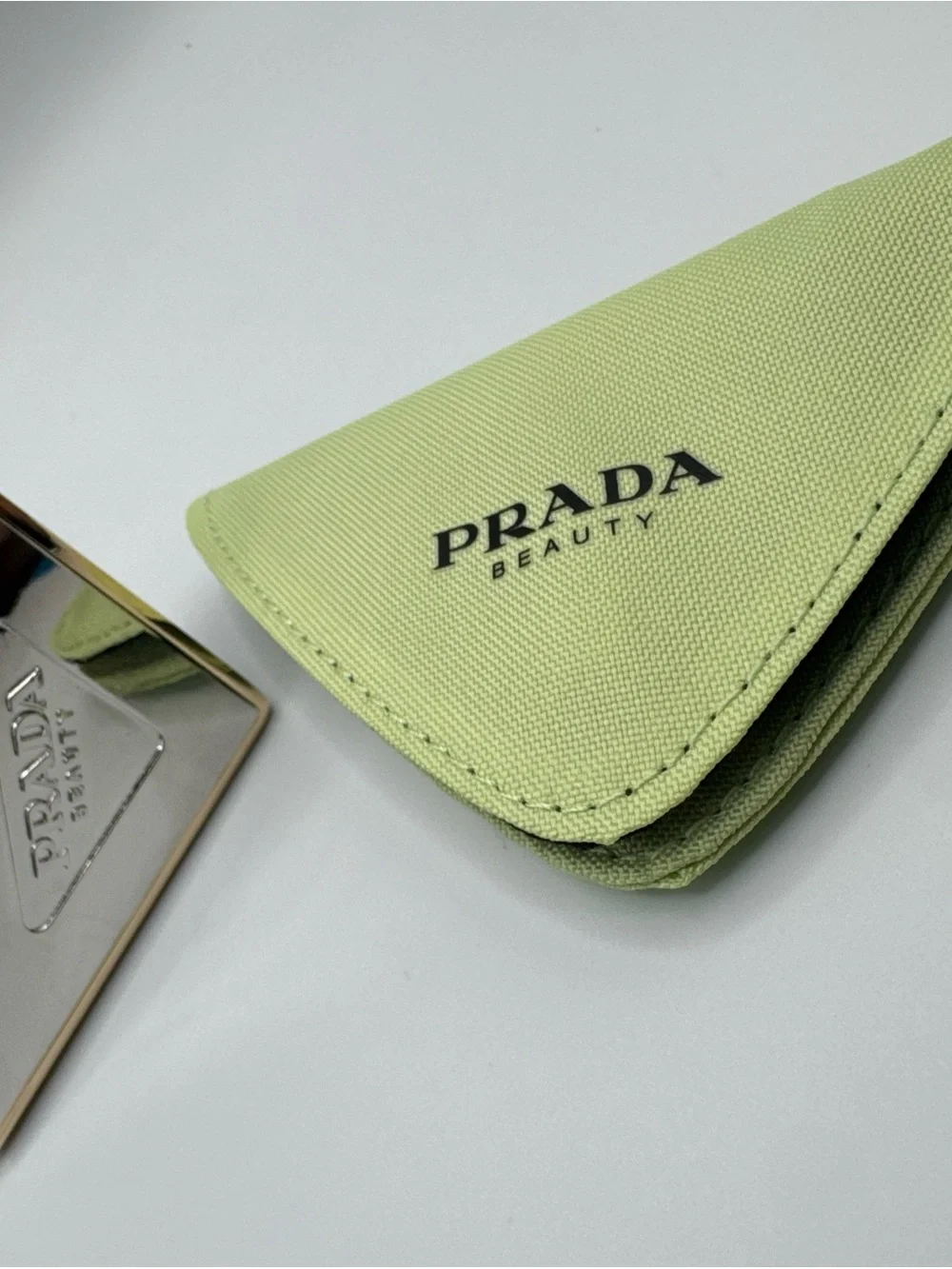 Prada triangle compact